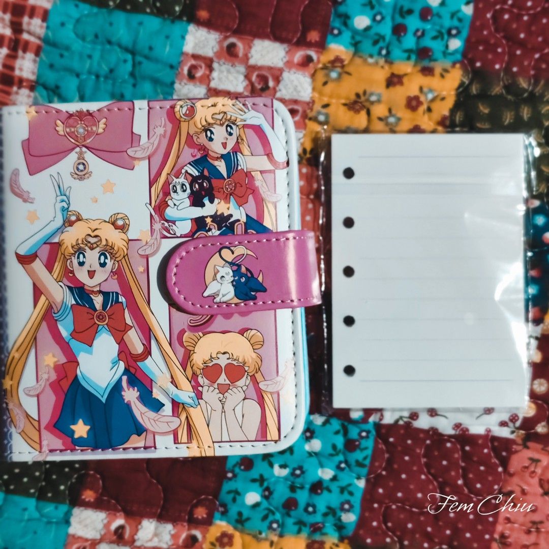 Sailor Moon items merch cards planner binder box tin can (Category: J-Wave Merchandise) located in Pateros City. Submitted by soshifem (Listing ID 1462427952, Image 2). Description: Sailormoon items 🩷planner/notebook (size mini A6) with refills - 350 🩷 1 box of holographic cards - 150 🩷 tin can - 150.