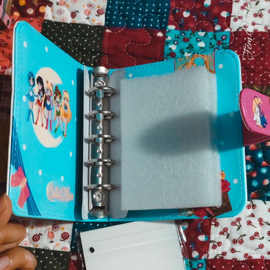 Sailor Moon items merch cards planner binder box tin can (Category: J-Wave Merchandise) located in Pateros City. Submitted by soshifem (Listing ID 1462427952, Image 3). Description: Sailormoon items 🩷planner/notebook (size mini A6) with refills - 350 🩷 1 box of holographic cards - 150 🩷 tin can - 150.