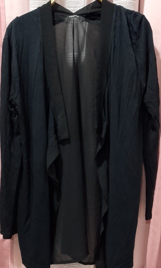 Sandro open-front black cardigan (Category: Coats, Jackets and Outerwear) located in Cabanatuan. Submitted by miss.maia (Listing ID 1462399031, Image 2). Description: The item pictured is a Sandro open-front black cardigan, featuring a draped, lightweight design with a mix of fabric textures along the lapels and a sheer fluid back paneled effect..