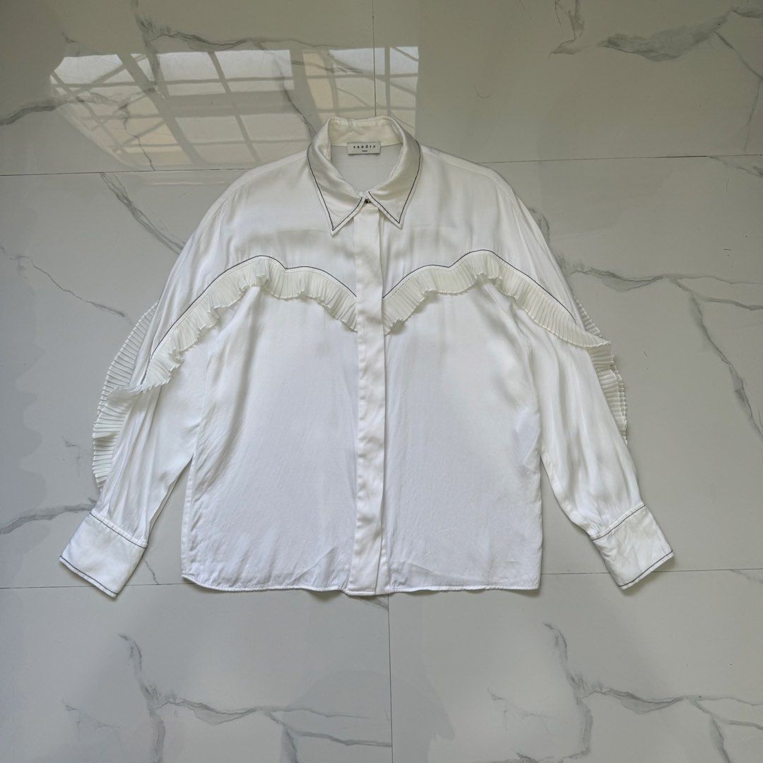 Sandro Ruffle Blouse Long Sleeves (Category: Longsleeves) located in Santo Tomas. Submitted by the580closet (Listing ID 1462364129, Image 1). Description: - Size: 3 19 inches - chest 26 inches - length 17 inches - shoulder 23 inches - sleeves.