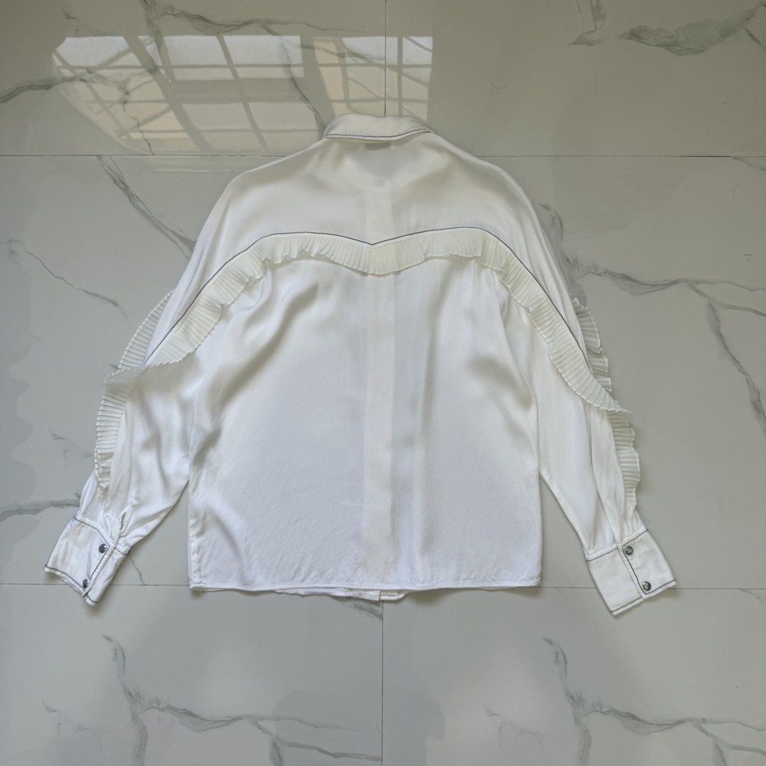 Sandro Ruffle Blouse Long Sleeves (Category: Longsleeves) located in Santo Tomas. Submitted by the580closet (Listing ID 1462364129, Image 3). Description: - Size: 3 19 inches - chest 26 inches - length 17 inches - shoulder 23 inches - sleeves.