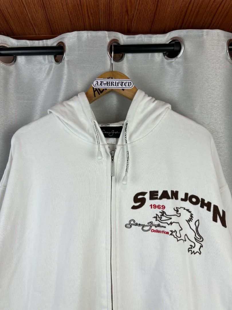 Sean John White Zip-Up Hoodie (Category: Hoodies) located in Tanza. Submitted by aldrintamayo (Listing ID 1462305954, Image 3). Description: - White Sean John zip-up hoodie - Features Sean John logo and lion graphic on the front - Signature Sean John script logo on the back and sleeve - Comfortable and stylish - Need Wash only. - Ideal for casual wear.
