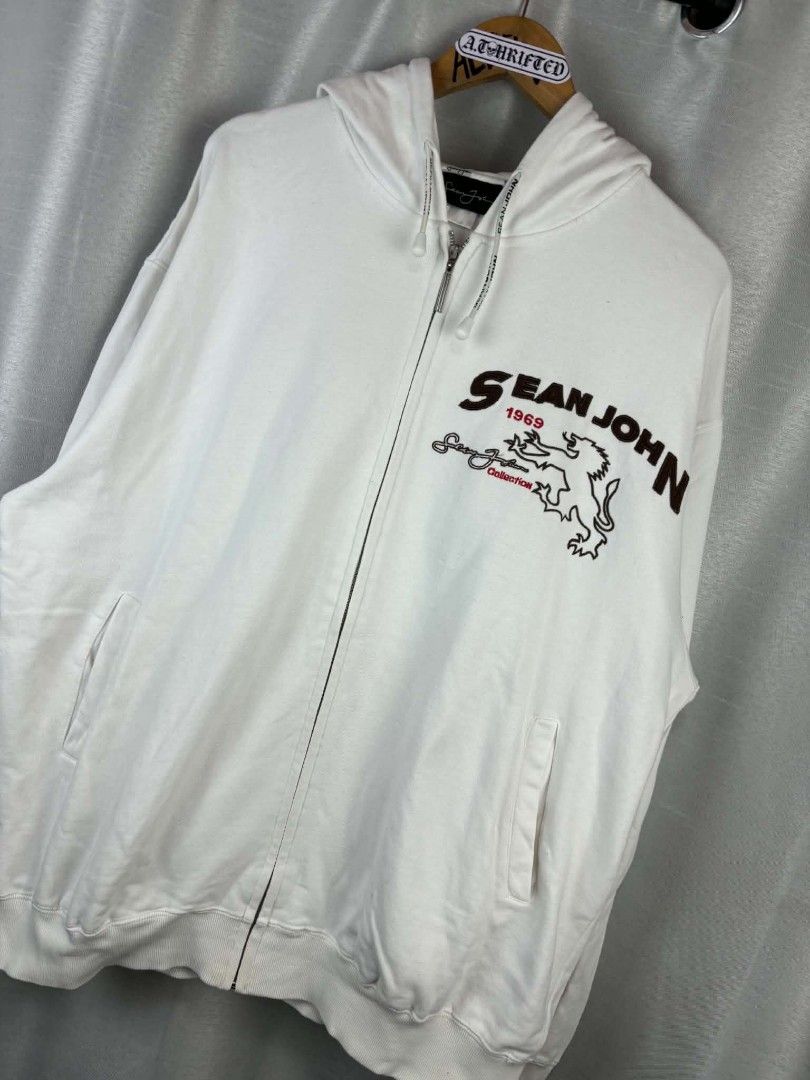Sean John White Zip-Up Hoodie (Category: Hoodies) located in Tanza. Submitted by aldrintamayo (Listing ID 1462305954, Image 2). Description: - White Sean John zip-up hoodie - Features Sean John logo and lion graphic on the front - Signature Sean John script logo on the back and sleeve - Comfortable and stylish - Need Wash only. - Ideal for casual wear.