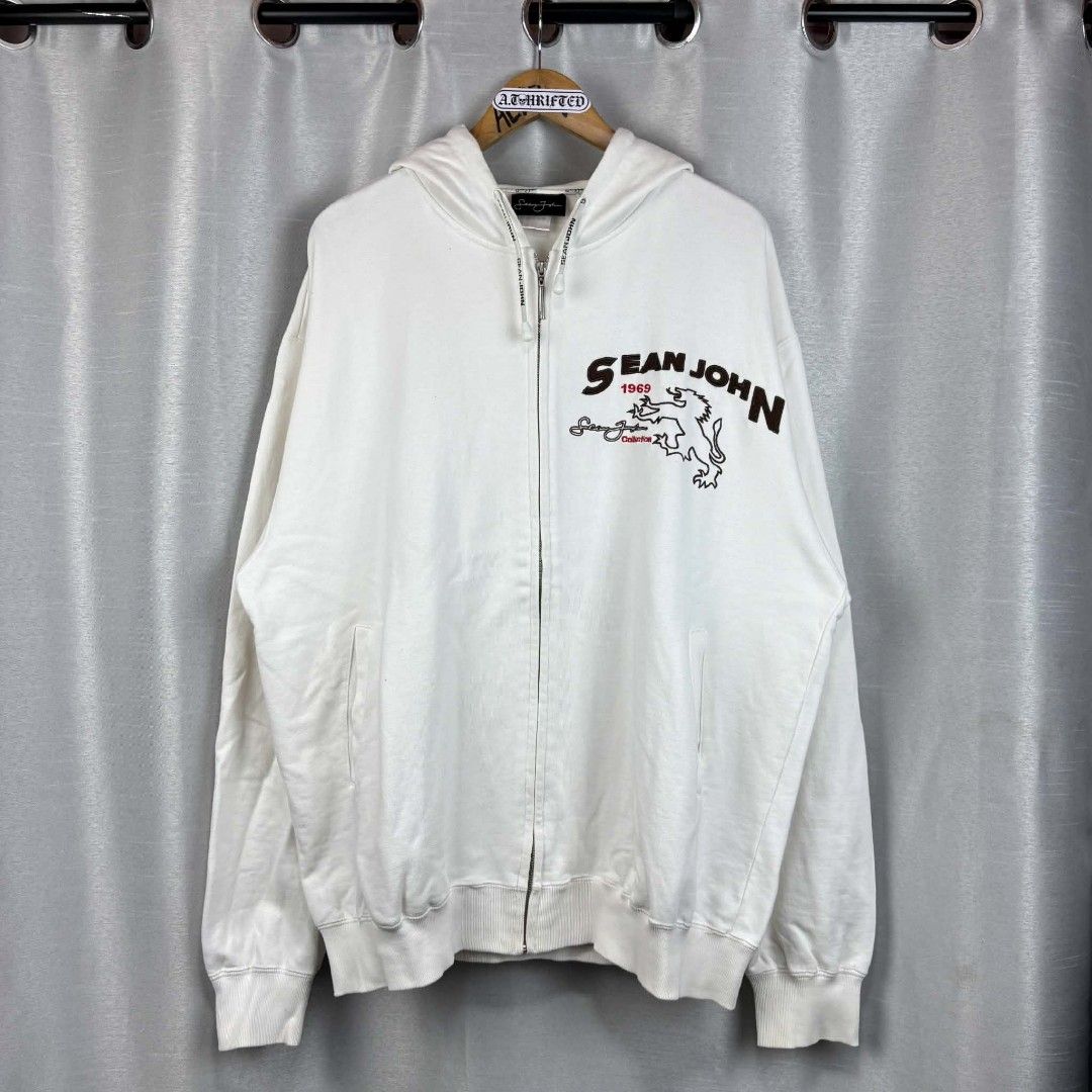 Sean John White Zip-Up Hoodie (Category: Hoodies) located in Tanza. Submitted by aldrintamayo (Listing ID 1462305954, Image 1). Description: - White Sean John zip-up hoodie - Features Sean John logo and lion graphic on the front - Signature Sean John script logo on the back and sleeve - Comfortable and stylish - Need Wash only. - Ideal for casual wear.
