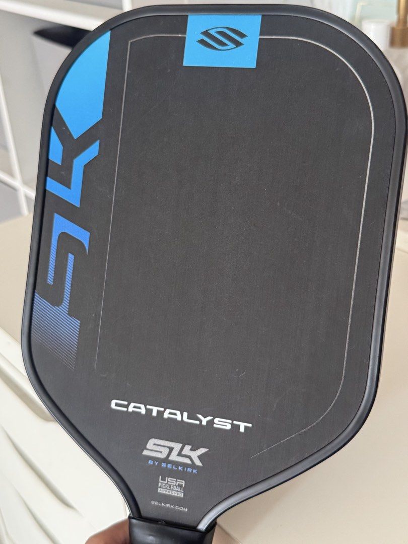 Selkirk SLK Catalyst Pickleball Paddle (Category: Racket and Ball Sports) located in Las Pinas. Submitted by liyadeclutters (Listing ID 1462314172, Image 2). Description: Raw carbon fiber Used for 1 month only (casual play) Grip taped upon purchase. Never removed Condition: Minor scuff marks on edge from normal play Bought for 3,400 at Toby’s .
