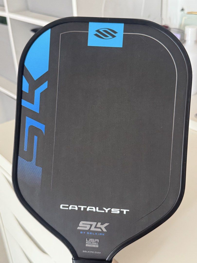 Selkirk SLK Catalyst Pickleball Paddle (Category: Racket and Ball Sports) located in Las Pinas. Submitted by liyadeclutters (Listing ID 1462314172, Image 3). Description: Raw carbon fiber Used for 1 month only (casual play) Grip taped upon purchase. Never removed Condition: Minor scuff marks on edge from normal play Bought for 3,400 at Toby’s .