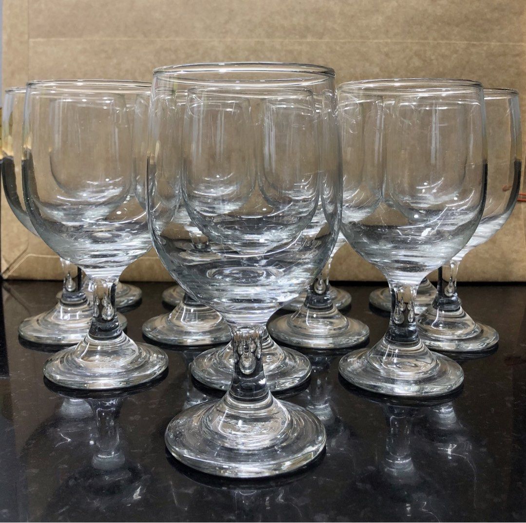 Wine Glasses (Category: Dinnerware & Cutlery) located in Quezon City. Submitted by may.reyes (Listing ID 1462276646, Image 1). Description: - Set of 12 clear glass wine glasses - Standard size, suitable for everyday or special occasions - Classic design with a sturdy stem and base - All glasses are clean and ready for a new home - Great for parties or personal use.