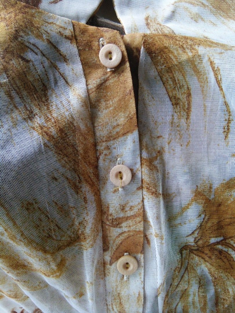 Sheer Floral Print Collared Button-Up Top (Category: Blouses) located in Meycauayan. Submitted by pau.trading (Listing ID 1462397069, Image 2). Description: - Sheer mesh fabric with a brown and tan floral print on white. - Collared neckline and button-up front. - Short sleeves. - Lightweight and airy. - Ideal for layering over camisoles or bralettes. note: last photo for styling inspo only.