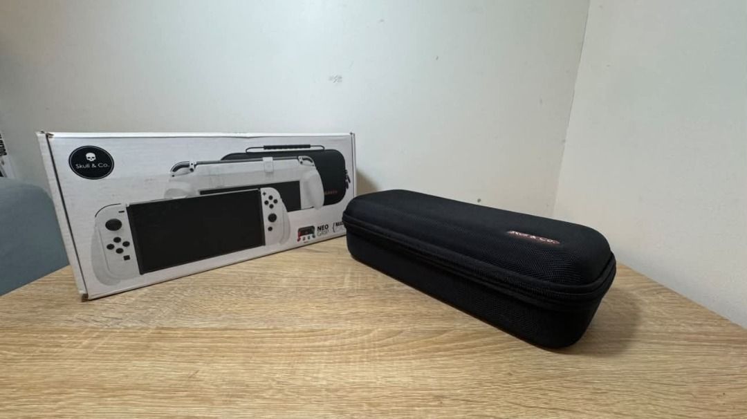 Skull & Co. NeoGrip Case for Nintendo Switch (Category: Cases & Covers) located in Taguig. Submitted by aaron.d28 (Listing ID 1462427103, Image 1). Description: - Skull & Co. NeoGrip Case for Nintendo Switch - Color: Black - Durable hard shell protection - Designed to fit Switch with grips attached - Spacious interior for accessories - Includes original packaging - Ideal for travel and on-the-go gaming.