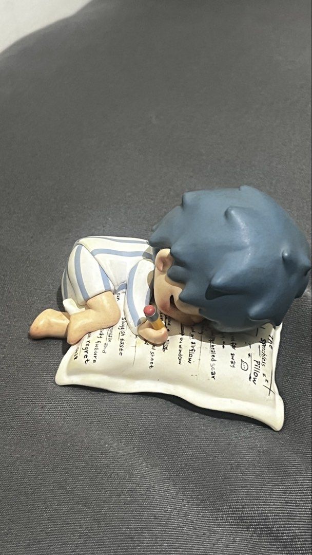 HIRONO - POEM (Category: Designer & Blind Box Toys) located in Manila. Submitted by asdfghjkl.mountain (Listing ID 1462387547, Image 1). Description: - Adorable figurine of a boy sleeping peacefully. - Dressed in cute striped pajamas. - Holding a tiny pencil, perhaps dreaming of ideas! - Pillow features charming writing. - Ideal for desk decoration or as a thoughtful gift. - Small, intricately detailed collectible piece. - no box.