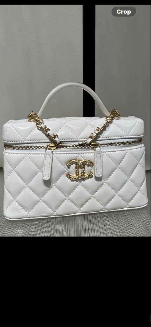 Slim vanity White Quilted Vanity Case Bag with Gold Hardware (Category: Luxury Bags & Wallets) located in Manila. Submitted by luxuryfinds88 (Listing ID 1462342233, Image 1). Description: - Chanel Vanity Case Bag real oil waxed leather (new leather) - Quilted Leather - Gold Chain Strap removable - Iconic CC Logo with Rhinestones - Zipper Closure - Ideal for Travel or Everyday Use - A Classic, Timeless Piece.