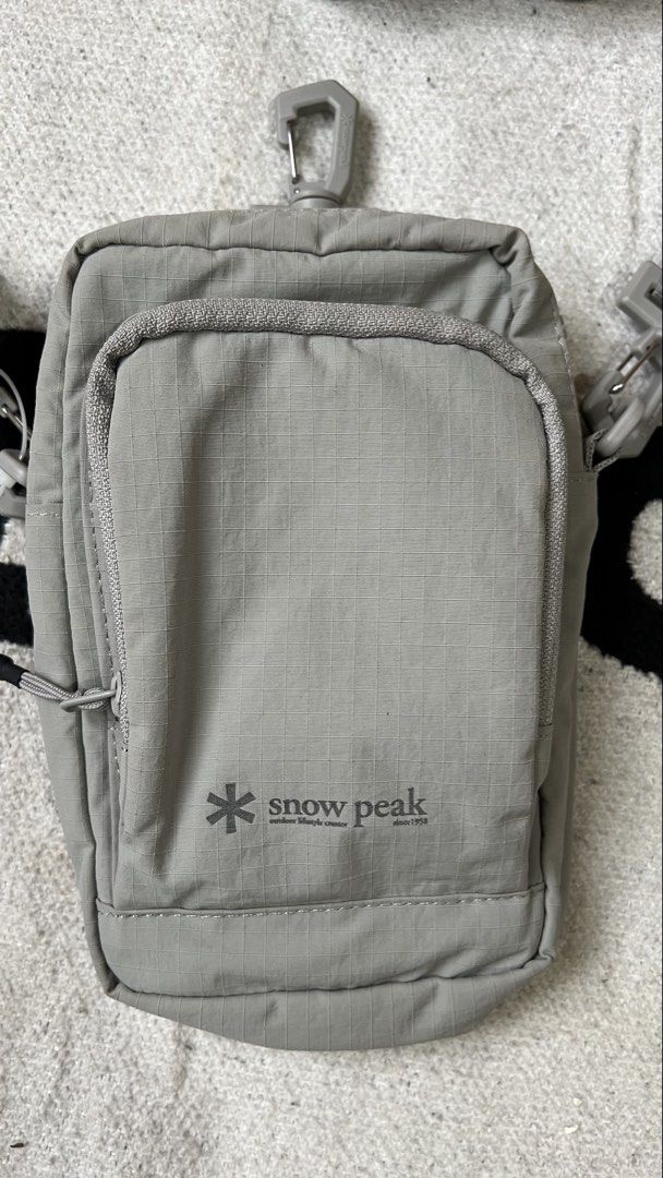 Snow Peak Grey Crossbody Bag (Category: Sling Bags) located in Cagayan de Oro. Submitted by nelsondel21723 (Listing ID 1462348319, Image 2). Description: - Grey Snow Peak crossbody bag - Features a front zip pocket and a main compartment - Adjustable strap with clips for a customized fit - Durable material for long-lasting use - Minimalist and stylish design - Ideal for everyday errands or travel adventures.