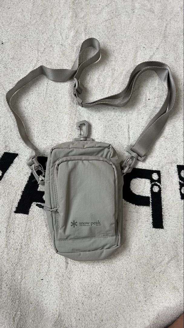 Snow Peak Grey Crossbody Bag (Category: Sling Bags) located in Cagayan de Oro. Submitted by nelsondel21723 (Listing ID 1462348319, Image 1). Description: - Grey Snow Peak crossbody bag - Features a front zip pocket and a main compartment - Adjustable strap with clips for a customized fit - Durable material for long-lasting use - Minimalist and stylish design - Ideal for everyday errands or travel adventures.