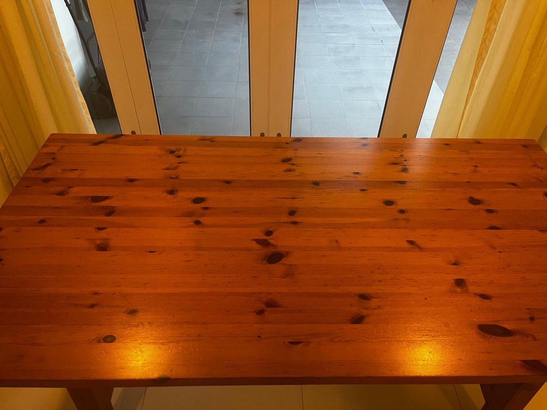 Solid Wood Dining Table (Category: Tables & Sets) located in Singapore. Submitted by dressesandsashes (Listing ID 1462352253, Image 3). Description: Solid Wood dining table. Natural wood grain and knots. Sturdy construction with cross-braced legs. Seats 6 people comfortably. This is well used but not abused. Do note that it does have markings and scratches. You’re open to come and view but this is not for fussies. Measurements: L179 cm W91 cm H76