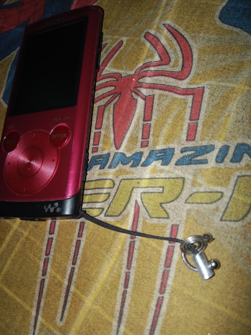 Sony Walkman NWZ-E354 MP3 Player Dark Red (Category: Portable Music Players) located in Magsaysay. Submitted by cleverdog_bcf581 (Listing ID 1462362847, Image 3). Description: - Sony Walkman MP3 Player - Model: NWZ-E354 - Color: Dark Red - Includes attached lanyard - Perfect for music on the go - Fully functional and works well - Has 30gb in it can download 1000 songs - Has charger and usb for transfering I also had a case but I'll give you 1 if 