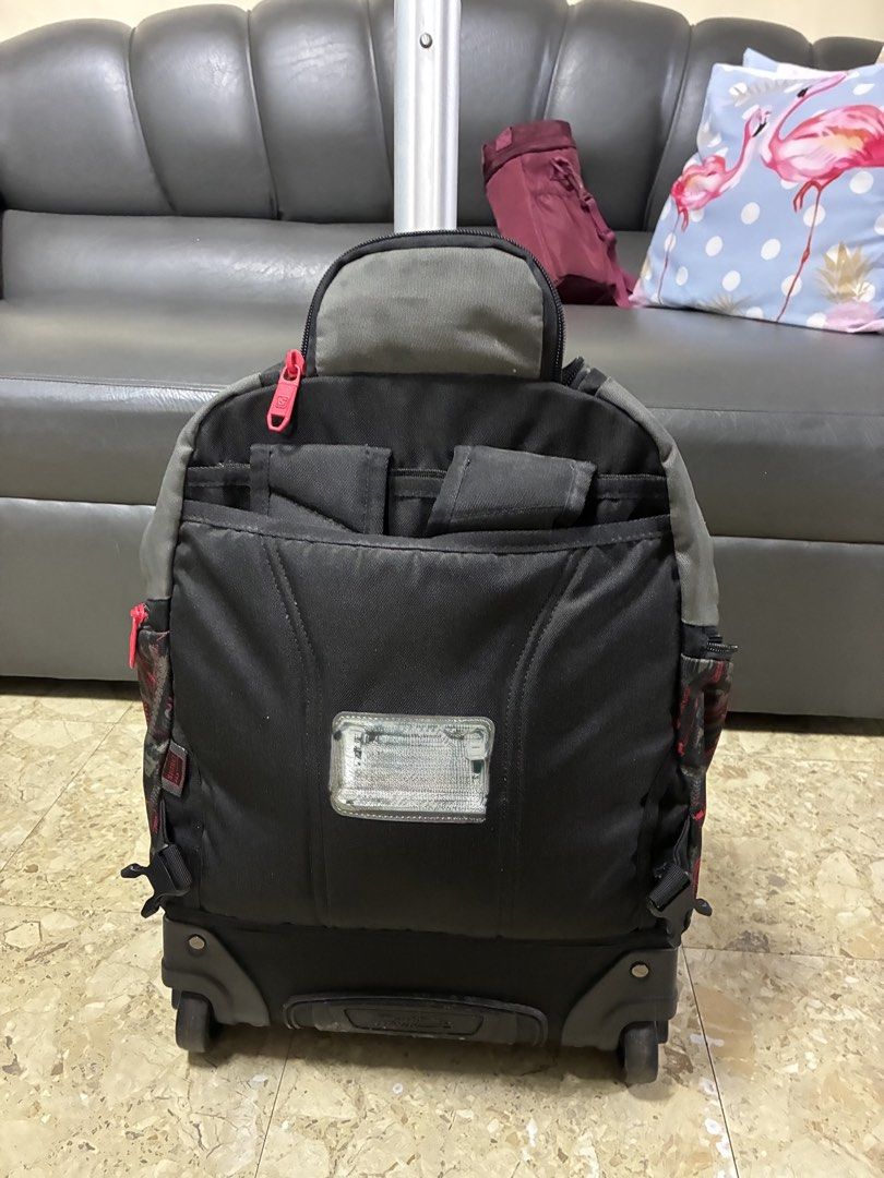 Sparky Rolling Backpack with Wheels and Handle (Category: Backpacks) located in Caloocan City. Submitted by Yourfayevoriteshoppe (Listing ID 1462400944, Image 3). Description: - Sparky rolling backpack with a cool monster truck design. - Stylish gray and black with vibrant red accents. - Features a retractable handle and smooth-rolling wheels for effortless transport. - Multiple zippered compartments keep belongings organized. - Ideal for school,