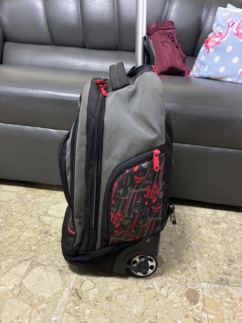 Sparky Rolling Backpack with Wheels and Handle (Category: Backpacks) located in Caloocan City. Submitted by Yourfayevoriteshoppe (Listing ID 1462400944, Image 2). Description: - Sparky rolling backpack with a cool monster truck design. - Stylish gray and black with vibrant red accents. - Features a retractable handle and smooth-rolling wheels for effortless transport. - Multiple zippered compartments keep belongings organized. - Ideal for school,
