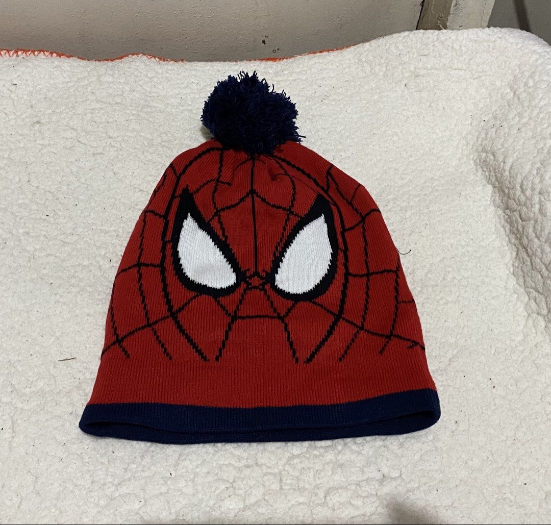 Spiderman Beanie Hat with Pom Pom (Category: Caps & Hats) located in Manila. Submitted by resi.diaz (Listing ID 1462335176, Image 1). Description: - Red and navy blue Spiderman beanie - Iconic Spiderman mask design on the front - All-over black web pattern - Navy blue pom pom on top - Ideal for Spiderman fans - Stay warm and stylish.