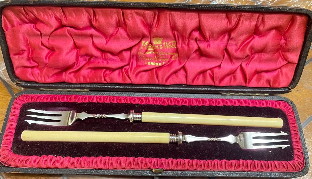 Sterling Silver Pickle Forks (Category: Dinnerware & Cutlery) located in Caloocan City. Submitted by eu_antiques53 (Listing ID 1462365659, Image 1). Description: - Antique sterling silver fork - Mapping & Webb brand - Genuine ivory handle - Intricate stem detailing - Authenticated with hallmarks - Comes in a velvet-lined presentation box - Hallmark: Sheffield 1898 - Length : 20cm - Perfect for collectors or special events.
