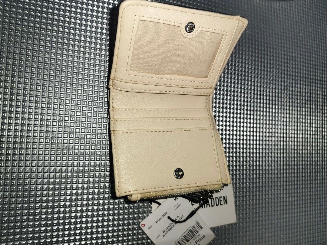 Steve Madden Blondie Snake Print Wallet (Category: Wallets & Card holders) located in Cavite. Submitted by mahthriftshop (Listing ID 1462413972, Image 3). Description: - Cute Steve Madden wallet - Stylish snake print design on the front - Cream interior with multiple card slots - Clear ID window for easy access - Zipper pocket at the bottom for coins or small items - Attached keychain ring - Brand new with original tags still on.