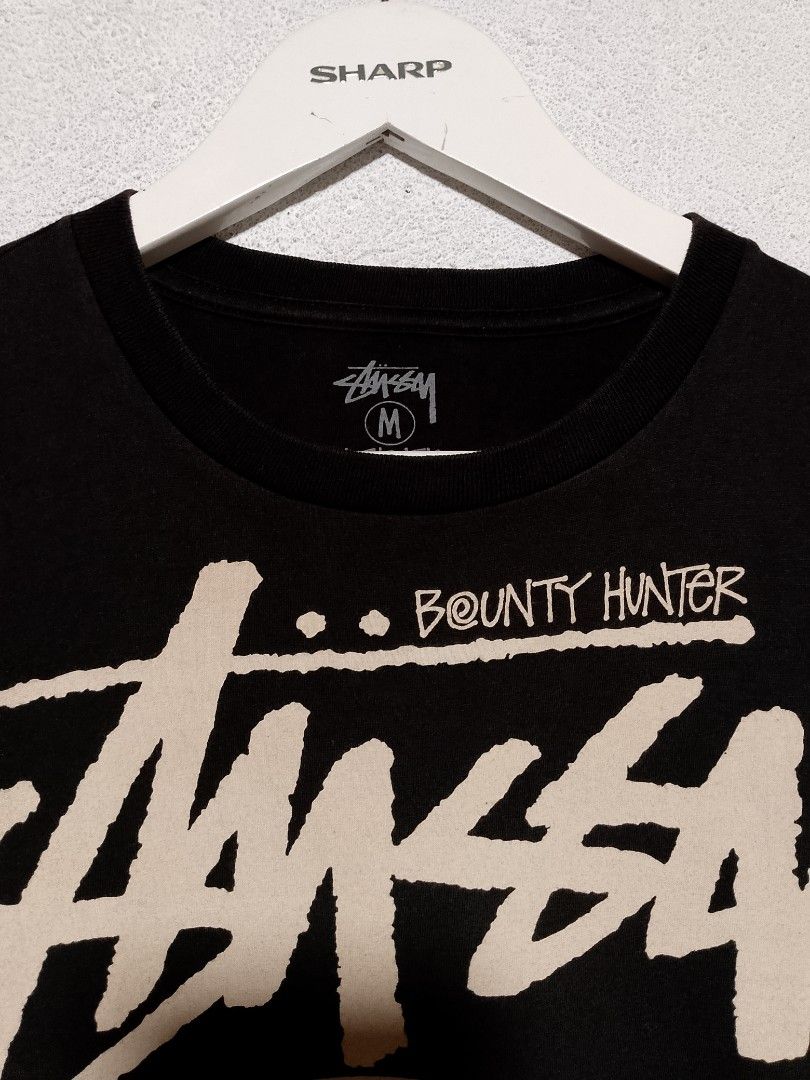 Stussy bounty hunter tshirt (Category: Tshirts & Polo Shirts ) located in Manila. Submitted by pj.thrift (Listing ID 1462362819, Image 3). Description: excellent condition size: medium on tag width: 20 length: 28 color rate: 9.5/10.