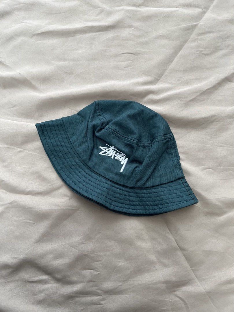 STUSSY BUCKET HAT (Category: Caps & Hats) located in Quezon City. Submitted by headline. (Listing ID 1462282671, Image 1). Description: STUSSY BUCKET HAT GREEN SIZE:M-L EMBROIDERY EXCELLENT CONDITION FOR ONLY:980php +SHIPPING FEE.