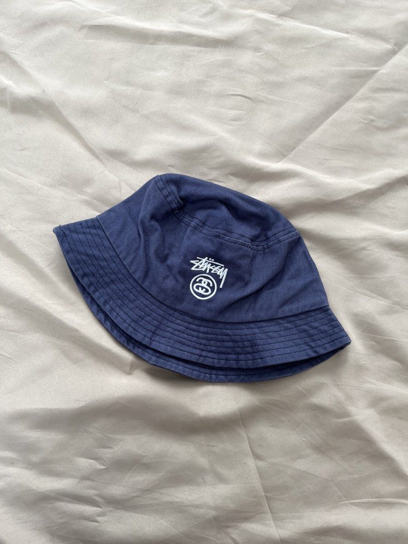 Stussy SS logo bucket hat (Category: Caps & Hats) located in Quezon City. Submitted by headline. (Listing ID 1462281116, Image 1). Description: STUSSY SS LOGO NAVY BLUE SIZE:M-L EXCELLENT CONDITION FOR ONLY:650php +SHIPPING FEE.