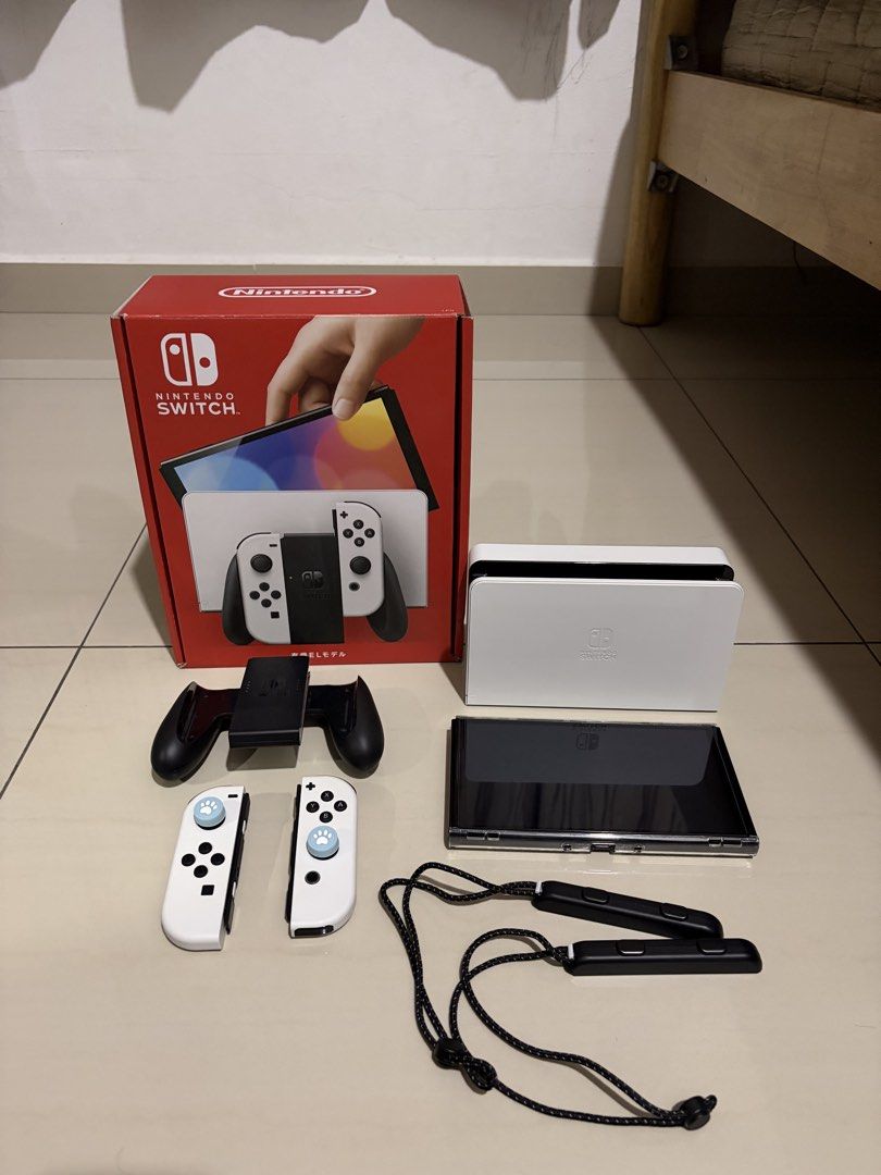 switch oled (Category: Nintendo) located in Georgetown. Submitted by yeohchiajie (Listing ID 1462336222, Image 1). Description: Condition: 9/10 Well-preserved Comes with all accessories and the box.