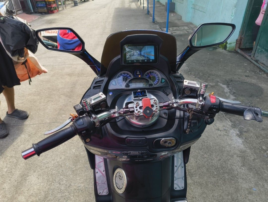 SYM GTS 300i Evo (Category: Motorbikes for Sale) located in Manila. Submitted by rija41819 (Listing ID 1462300361, Image 3). Description: SYM GTS 300i evo scooter for sale. Black color. Has a large rear top box for storage. Blue tinted windshield. Digital voltmeter installed. Have installed cameras and dashboard device. Ready for the road. Dm for more info pag usapan natin kaya panaman babaan.