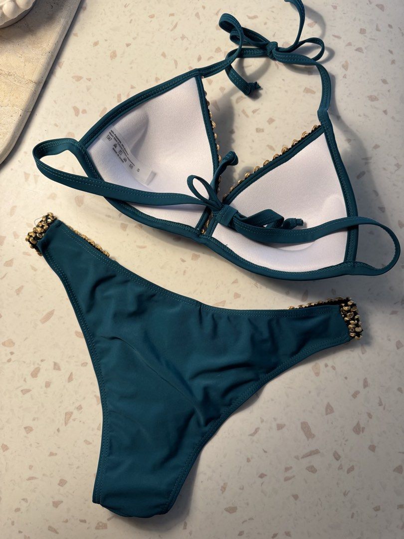 Teal Bikini with Gold Embellishments (Category: Bikinis & Swimsuits) located in Las Pinas. Submitted by patringcia_14 (Listing ID 1462317196, Image 3). Description: - Stunning teal bikini set - Eye-catching gold sequin and bead detailing along edges - Halter neck top with adjustable tie closure - Comfortable moderate cut bikini bottoms - Ideal for beach days, pool parties, and vacations.