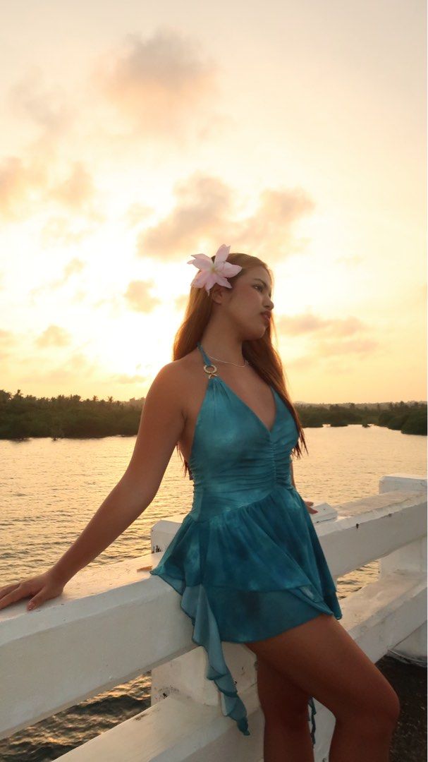 Teal Halter Neck Ruffled Mini Dress (Category: Dresses) located in Manila. Submitted by jminacraf26908 (Listing ID 1462214961, Image 1). Description: - Teal halter neck mini dress - Ruching detail on the bodice - Ruffled hemline - Ties at the back - Ideal for beach vacations or summer parties - Lightweight and flowy fabric.