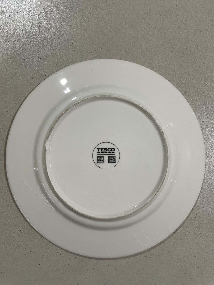 Tesco Blue Striped Dinner Plate (Category: Dinnerware & Cutlery) located in Quezon City. Submitted by meggoquingco (Listing ID 1462342979, Image 2). Description: - White dinner plate with classic blue stripes - Brand: Tesco - Size: Approximately 10.5 inches in diameter - Condition: Shows minor signs of wear, but still in good, presentable condition - Ideal for: Everyday meals or as a replacement for a missing piece.