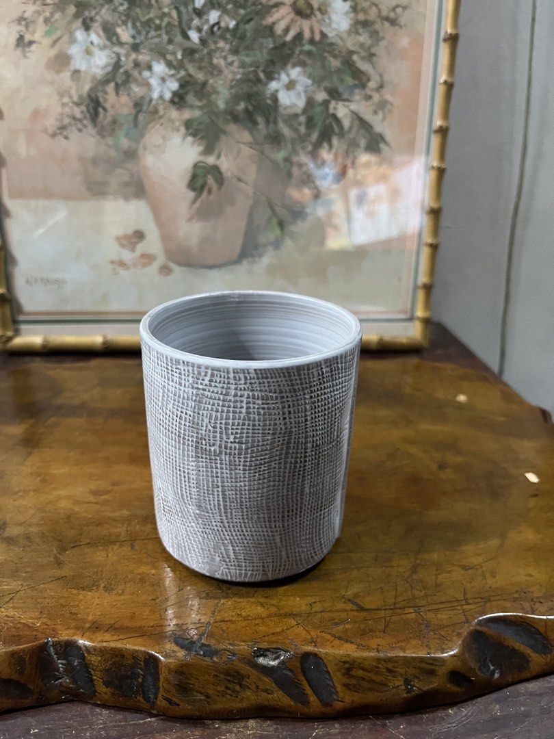 Textured Ceramic Cup (Category: Dinnerware & Cutlery) located in Taguig. Submitted by minmin_parker (Listing ID 1462355592, Image 1). Description: - Modern grey ceramic cup - Textured exterior for a unique feel - Versatile: Use for coffee, tea, or as a small planter - Minimalist design to complement any decor - Approximately 4 inches tall.