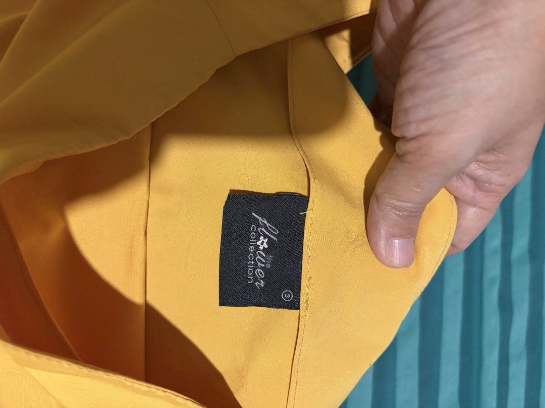 The Flower Collection Yellow Off-Shoulder Top (Category: Blouses) located in Las Pinas. Submitted by ces0427 (Listing ID 1462438955, Image 2). Description: - Yellow off-shoulder top - Brand: The Flower Collection - Features wide, fluttery sleeves - Estimated size: Medium (M) - Versatile for casual or dressed-up looks - Comfortable fabric - Condition: Worn only once.