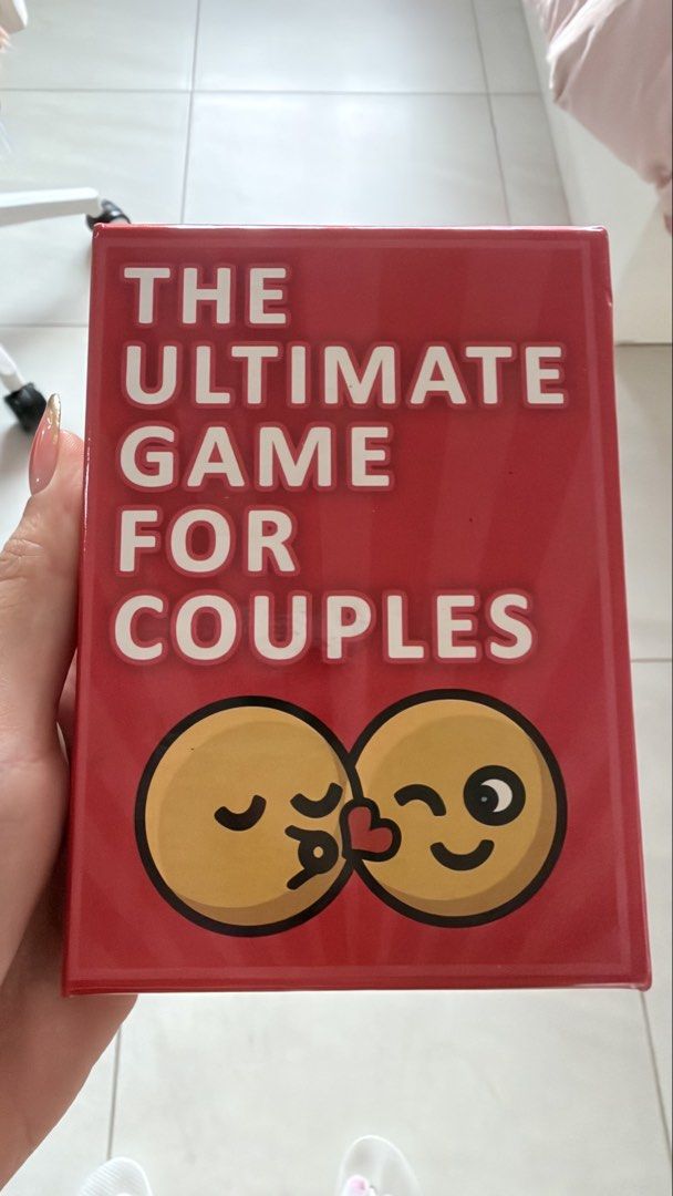 The Ultimate Game For Couples Card Game (Category: Board Games & Puzzles) located in Pasig City. Submitted by shopchampagnedreams (Listing ID 1462289422, Image 1). Description: - Fun card game designed for couples. - Ideal for date nights or adding excitement to your relationship. - Comes in a compact, eye-catching red box with cute emoji graphics. - Helps couples get to know each other better and share laughs. - Easy to learn and play, fostering