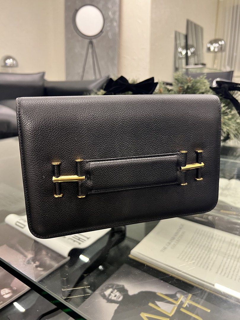 Tom Ford Front Strap Leather Clutch in Black (Category: Luxury Bags & Wallets) located in Manila. Submitted by monicacheska (Listing ID 1462376010, Image 1). Description: AUTHENTIC Tom Ford T-Strap Grained Leather Flap Clutch (Black / Gold) Up for sale is a classic and versatile Tom Ford Front Strap Leather Clutch in timeless black pebbled calfskin with rich gold-tone hardware. Product Details: Design: Front slot/hand strap accented with Tom Ford