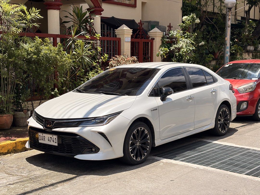 Toyota Corolla Altis 1.8 (A) (Category: Used Cars) located in Manila. Submitted by pprelovedbyshannennn (Listing ID 1462385188, Image 1). Description: FOR SALE 🏷️ Toyota Corolla Altis Hybrid 2022 GR-S (Limited Edition) Year Model: 2022 ODO: 32k Engine: 1.8 Gas Hybrid Color: Platinum White Pearl Type of Fuel: Gasoline Automatic transmission 17” GR-S alloy wheels Michelin Tires Includes Spare tire with tools and jack Power windows all working Codi
