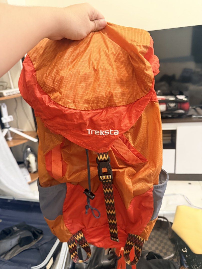 Treksta Orange Foldable Backpack (Category: Backpacks) located in Caloocan City. Submitted by geemariell56161 (Listing ID 1462413888, Image 1). Description: - Treksta Orange Foldable Backpack - Lightweight and compact design - Ideal for travel and day trips - Convenient side pockets for water bottles - Secure zip closure - Easily packable for storage.