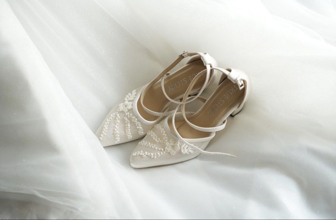 True Story Evermore Bridal Heels (Category: Heels) located in Mandaluyong City. Submitted by stephmariano (Listing ID 1462330649, Image 1). Description: - Brand: True Story Evermore - Color: White - Features: Delicate floral beadwork on the front, thin ankle strap - Heel height: 3in block heels with platform (feels like 2.5in heels) VERY comfortable for walking - Occasion: Ideal for weddings and special events.