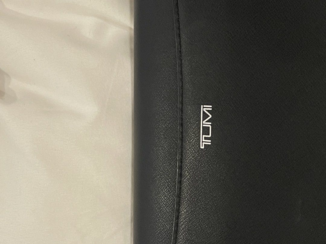Tumi Black Leather Olas Shoulder Bag (Category: Cross-body Bags) located in San Juan City. Submitted by declutterrrsale (Listing ID 1462324643, Image 3). Description: Barely used! Good as brand new. Selling for almost half the price. Store price is 45K! RFS: not using - Brand: Tumi - Material: Black Leather - Design: Sleek with silver hardware accents - Strap: Adjustable for comfortable wear - Interior: Multiple compartments for organization - Be