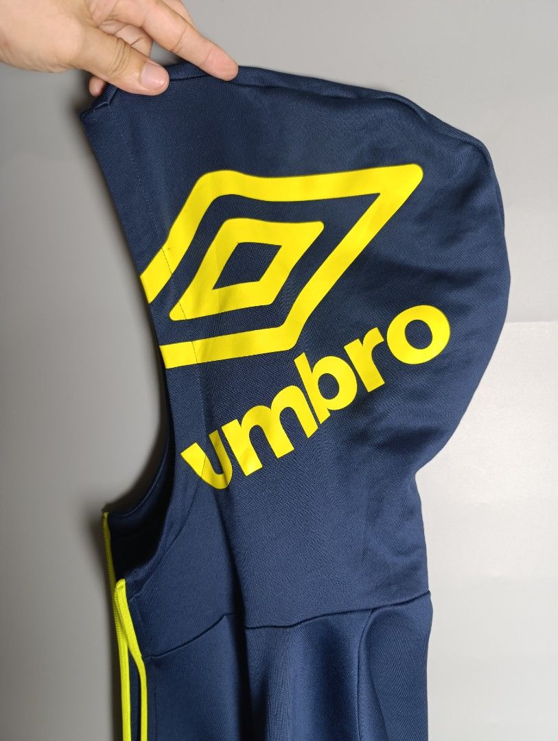 Umbro Navy Blue Zip-Up Hoodie Jacket (Category: Coats, Jackets and Outerwear) located in Magalang. Submitted by acethriftonlineshop (Listing ID 1462433319, Image 3). Description: Umbro Full-Zip Hoodie Track Jacket Dimension: 23 x 28 Size: L-XL Price: 549.