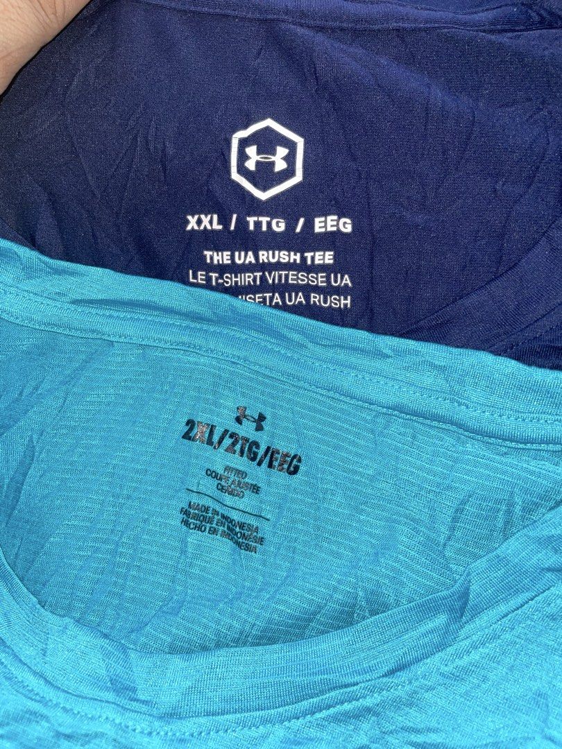 Under Armour Rush Tee - XXL/TTG/EEG - Blue & Teal (Category: Tshirts & Polo Shirts ) located in Manila. Submitted by clementdav22513 (Listing ID 1462355801, Image 2). Description: - Set of 2 Under Armour Rush Tees - Size: XXL/TTG/EEG - Colors: Navy Blue and Teal - Teal tee features a Mercedes-Benz logo on the chest - Made in Indonesia - Ideal for workouts or casual wear - Bundle deal available for both tees.