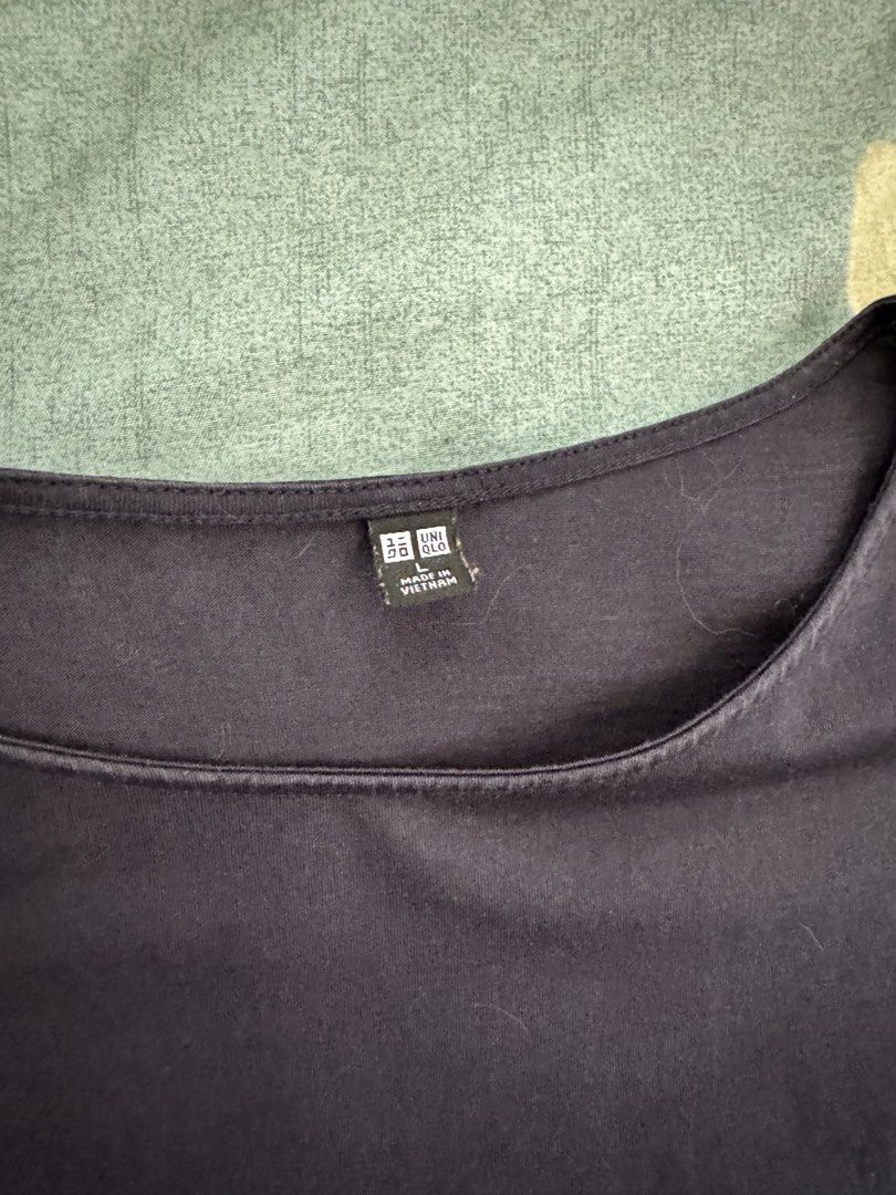 Uniqlo Blouse (Category: Blouses) located in Bustos. Submitted by shergusshop.ph (Listing ID 1462277591, Image 2). Description: Uniqlo blouse in navy with puff sleeves size L. Please refer to photos for measurements. MOP: BDO, Gcash Location: Bulacan.