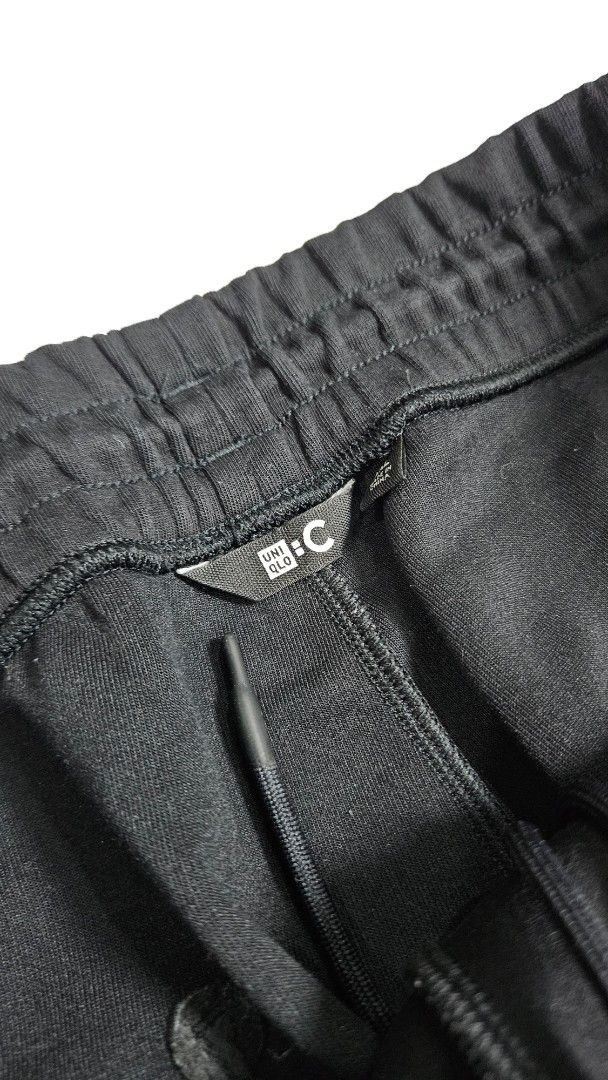 Uniqlo C Black sweatpants (Category: Joggers) located in Alfonso. Submitted by jbcamet (Listing ID 1462415227, Image 2). Description: - Uniqlo Black Jogger Pants - Size: XXL (fits waist 100-108cm) - Material: Polyester & Cotton Blend - Features: Elastic waistband with drawstring, side pockets - Perfect for: Comfortable everyday wear - Origin: Made in China.