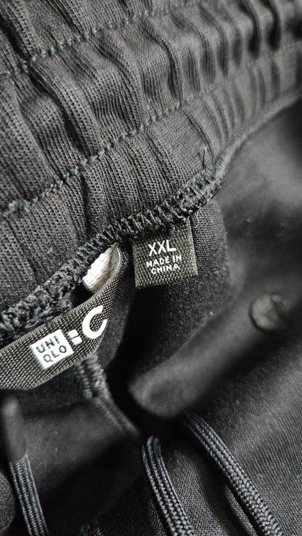 Uniqlo C Black sweatpants (Category: Joggers) located in Alfonso. Submitted by jbcamet (Listing ID 1462415227, Image 3). Description: - Uniqlo Black Jogger Pants - Size: XXL (fits waist 100-108cm) - Material: Polyester & Cotton Blend - Features: Elastic waistband with drawstring, side pockets - Perfect for: Comfortable everyday wear - Origin: Made in China.