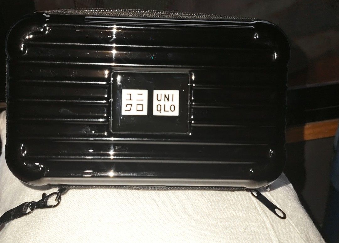 UNIQLO Limited Edition Black Hard Shell Bag (Category: Purses & Pouches) located in Dipolog. Submitted by queenibee01 (Listing ID 1462327627, Image 1). Description: - UNIQLO Black Hard Shell Cosmetic Bag - Secure zippered closure - Convenient wrist strap - Internal mesh pockets for organization - Ideal for travel or everyday use - Compact and easy to carry.