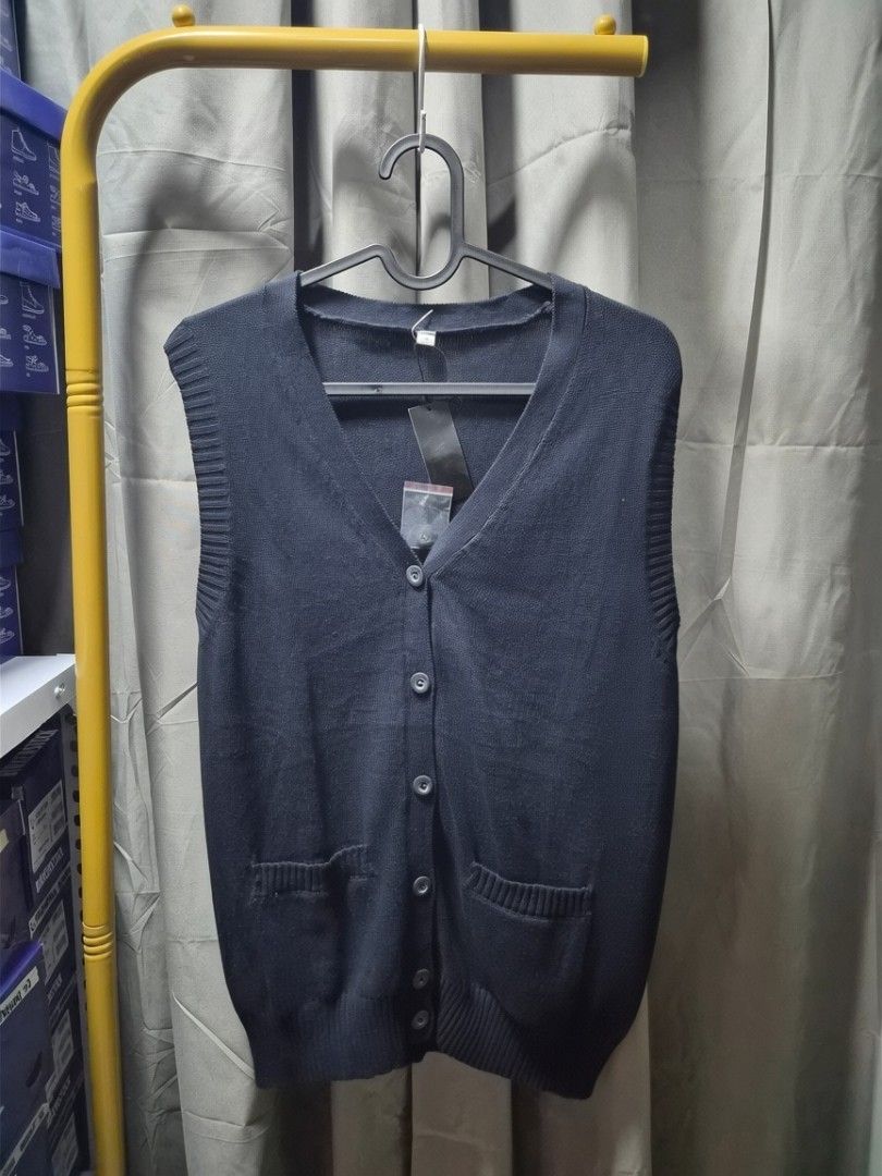 Unisex Knit Button-Up Vest with Pockets (Category: Vests) located in Taguig. Submitted by chloe_clothingco. (Listing ID 1462355466, Image 2). Description: - Classic knit vest - V-neckline - Button-up front - Two front pockets - Ideal for layering - Available in beige and navy.