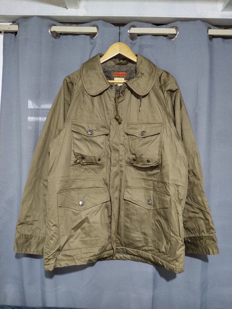 UNITED CARR by Buzz Rickson's Intermediate Field Jacket - (Category: Coats, Jackets and Outerwear) located in Pasig City. Submitted by loveforlux_2025 (Listing ID 1462339726, Image 1). Description: - Khaki Intermediate field jacket from UNITED CARR - Vintage From 1999 Archive - Warm, fuzzy lining for extra comfort - Multiple functional pockets on the front - Zipper and button closure for secure fit - Ideal for cooler weather - Hood attachment ins