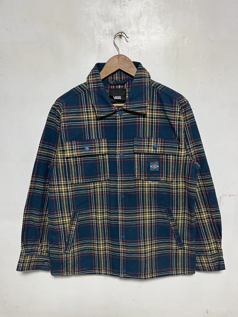 Vans Off The Wall Plaid Snap Button Jacket (Category: Coats, Jackets and Outerwear) located in Tanza. Submitted by feliciano4108 (Listing ID 1462298725, Image 1). Description: - Classic Vans plaid jacket - Size Medium - Snap button front closure - Snap button chest pockets - 'Off The Wall' graphic detail on the back - Ideal for layering or standalone wear.