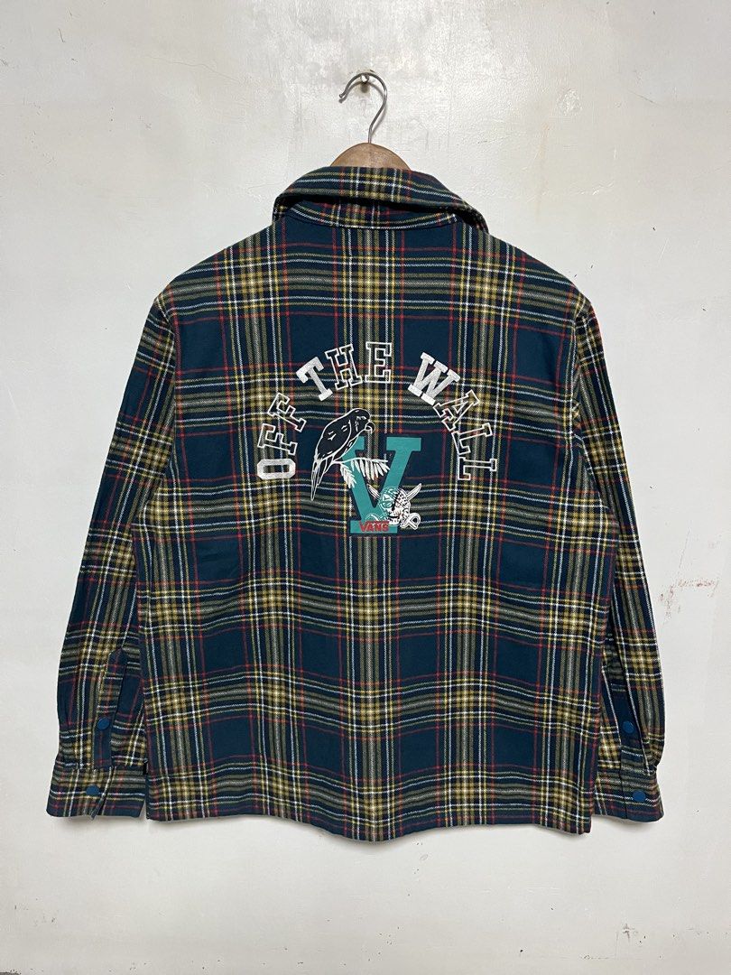 Vans Off The Wall Plaid Snap Button Jacket (Category: Coats, Jackets and Outerwear) located in Tanza. Submitted by feliciano4108 (Listing ID 1462298725, Image 2). Description: - Classic Vans plaid jacket - Size Medium - Snap button front closure - Snap button chest pockets - 'Off The Wall' graphic detail on the back - Ideal for layering or standalone wear.